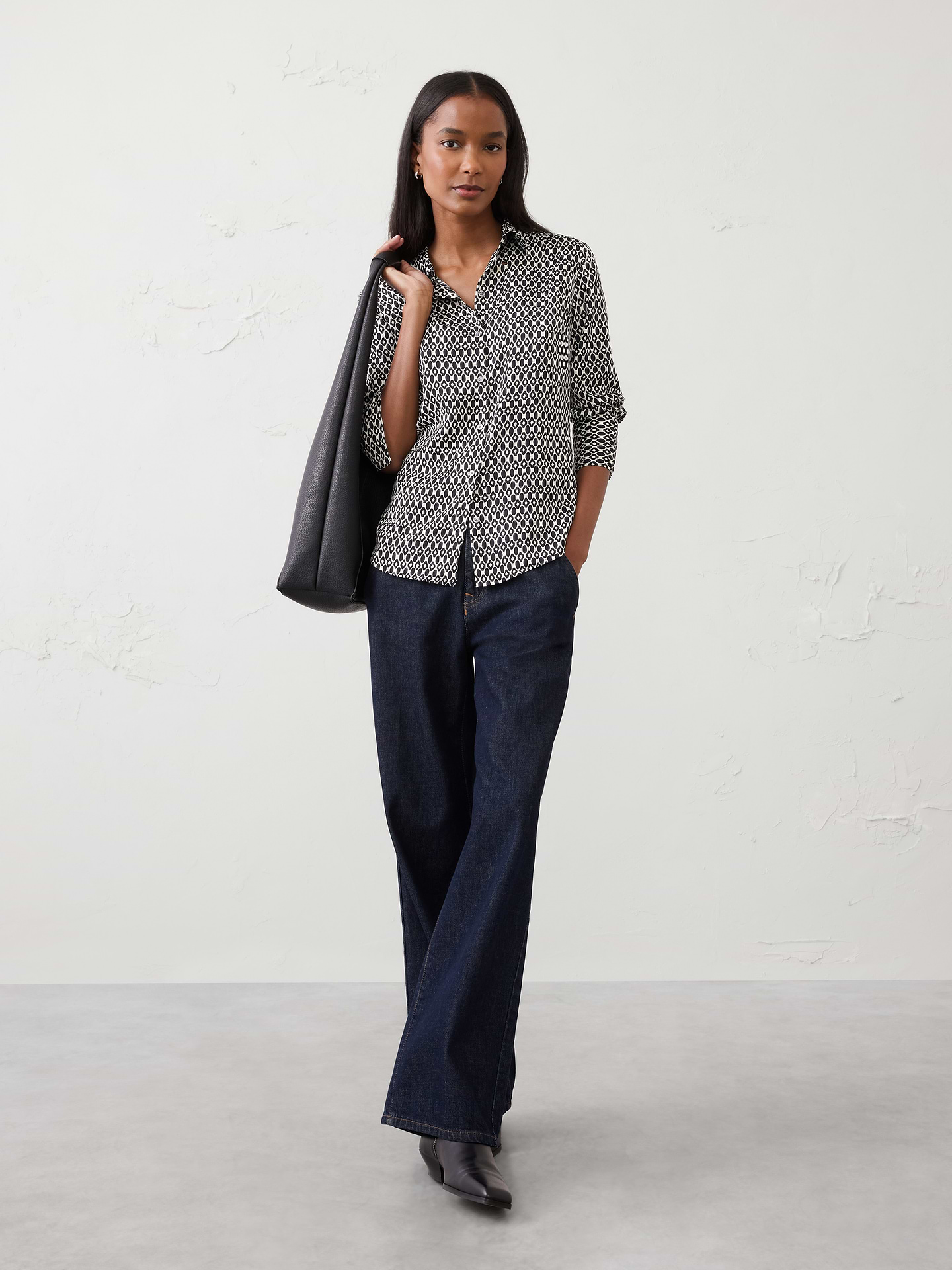 Image 1 of 8, Relaunch to our classic silky shirt in new recycled polyester fabric, silky crepe. More of a cleaner matte finish making this piece more elevated and modern., Point collar. Long sleeves with button cuffs., Button front closure., Back yoke with center box pleat., Shirttail hem., Made exclusively for Banana Republic Factory., Product #890602
