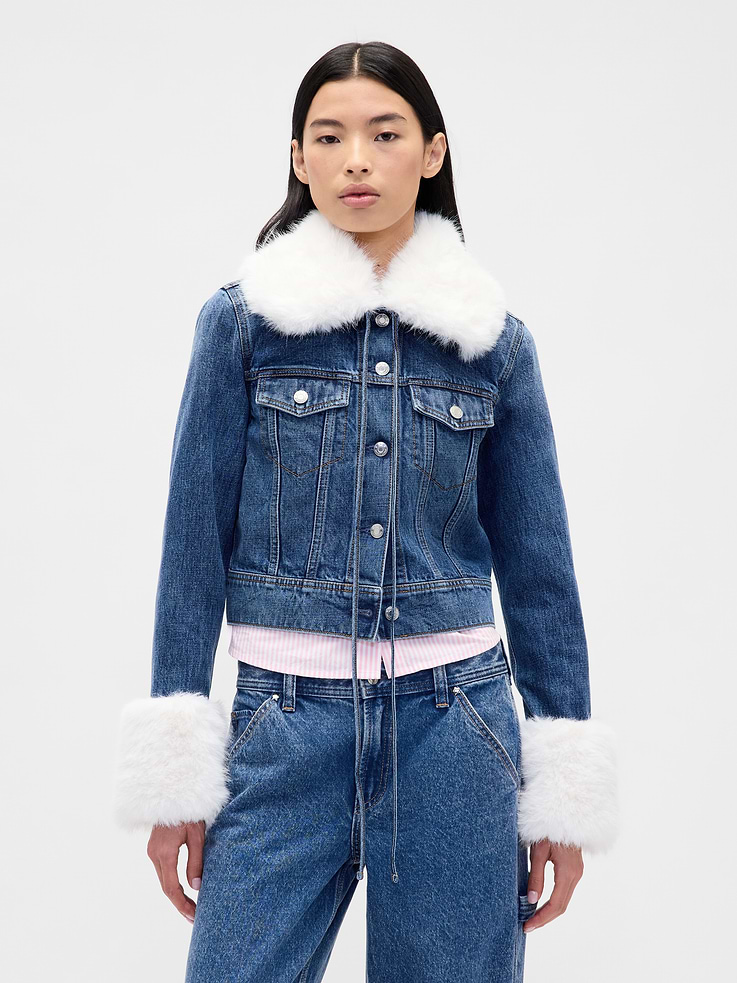 Image 1 of 2, Sandy Liang is designer born and raised in NYC. Inspired by nostalgia, she creates cult-favorite pieces influenced by childhood. Our collection draws from her memories of growing up with Gap. Archival hints. Playful details for adults. Elevated designs for kids. A celebration of modern girlhood only Gap x Sandy Liang could make., Authentic, non-stretch denim jacket. In a slim, cropped fit., Round collar with ties., Long sleeves., Button front., Button-flap patch pockets at front., Removable vegan fur trim at collar and cuffs., Responsibly Made: This jacket is part of our water-saving Washwell program. Compared with conventional wash methods, Washwell uses at least 20% less water., More Sustainable Materials: Jacket is made with 5% recycled cotton and trim is made with 100% recycled polyester. Compared to virgin materials, using recycled materials helps reduce resource use and waste., Product #853524