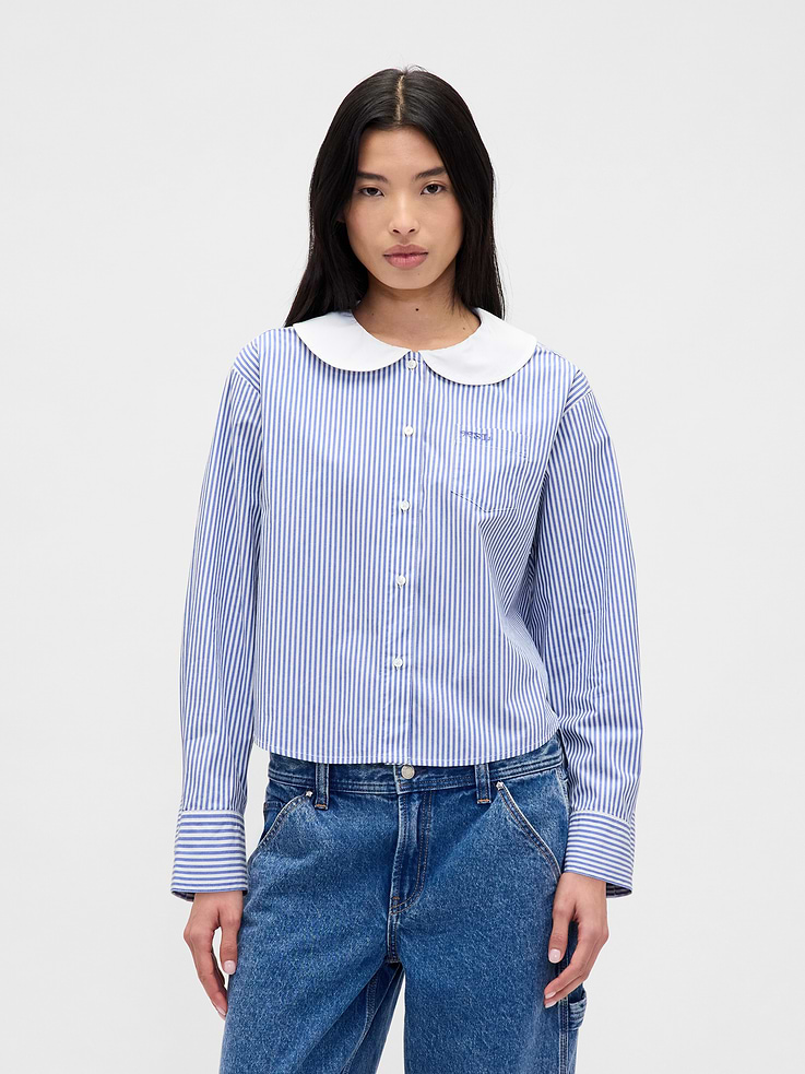 Image 1 of 2, Sandy Liang is designer born and raised in NYC. Inspired by nostalgia, she creates cult-favorite pieces influenced by childhood. Our collection draws from her memories of growing up with Gap. Archival hints. Playful details for adults. Elevated designs for kids. A celebration of modern girlhood only Gap × Sandy Liang could make., Soft, stretch cotton poplin shirt. In an extra-oversized, slightly cropped fit., Round collar, button front., Long sleeves with button cuffs., Embroidered patch pocket at chest., Allover stripes., Product #853521