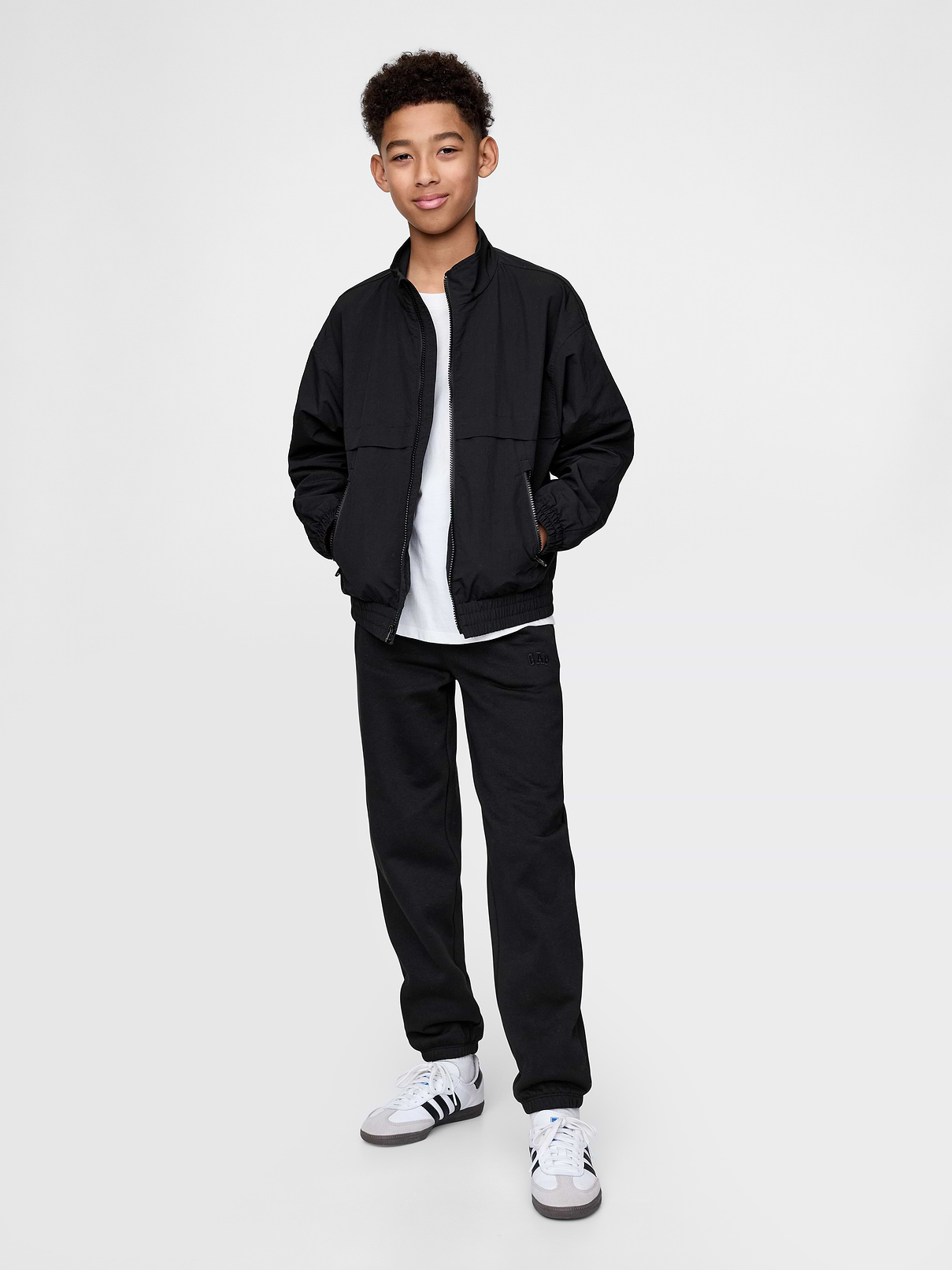 Image 1 of 4, Our softer than soft sweats. Brushed on the inside. Smooth on the outside. Made so that no two are alike., Soft cotton-blend fleece pull-on joggers., Elasticized waist with inner drawcords., Side welt pockets, back patch pocket., Gap logo at thigh., Elasticized cuffs., Made with 23% recycled polyester. Compared to virgin materials, using recycled materials helps to reduce resource use and waste., This product was made in a factory that invests in gender equity and women’s empowerment through RISE. Learn more at gapinc.com/equity ., Product #745898