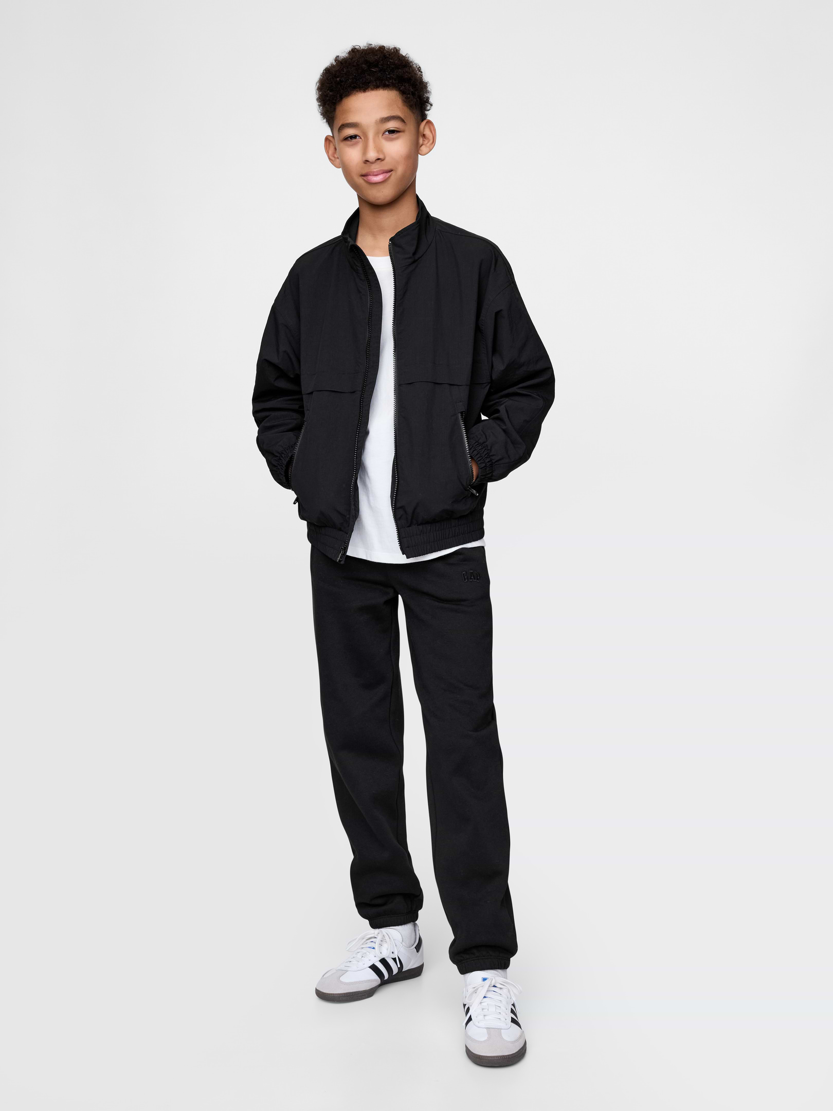 Image 1 of 4, Our softer than soft sweats. Brushed on the inside. Smooth on the outside. Made so that no two are alike., Soft cotton-blend fleece pull-on joggers., Elasticized waist with inner drawcords., Side welt pockets, back patch pocket., Gap logo at thigh., Elasticized cuffs., Made with 23% recycled polyester. Compared to virgin materials, using recycled materials helps to reduce resource use and waste., This product was made in a factory that invests in gender equity and women’s empowerment through RISE. Learn more at gapinc.com/equity ., Product #745898