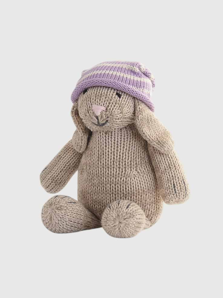 Image 1 of 2, This hand-knit bunny plush, complete with a cozy striped hat, is crafted from soft, durable yarn for hours of snuggles and fun., The bunny's gentle expression and floppy ears add charm, while its timeless, handcrafted style makes it a perfect heirloom piece or thoughtful gift.