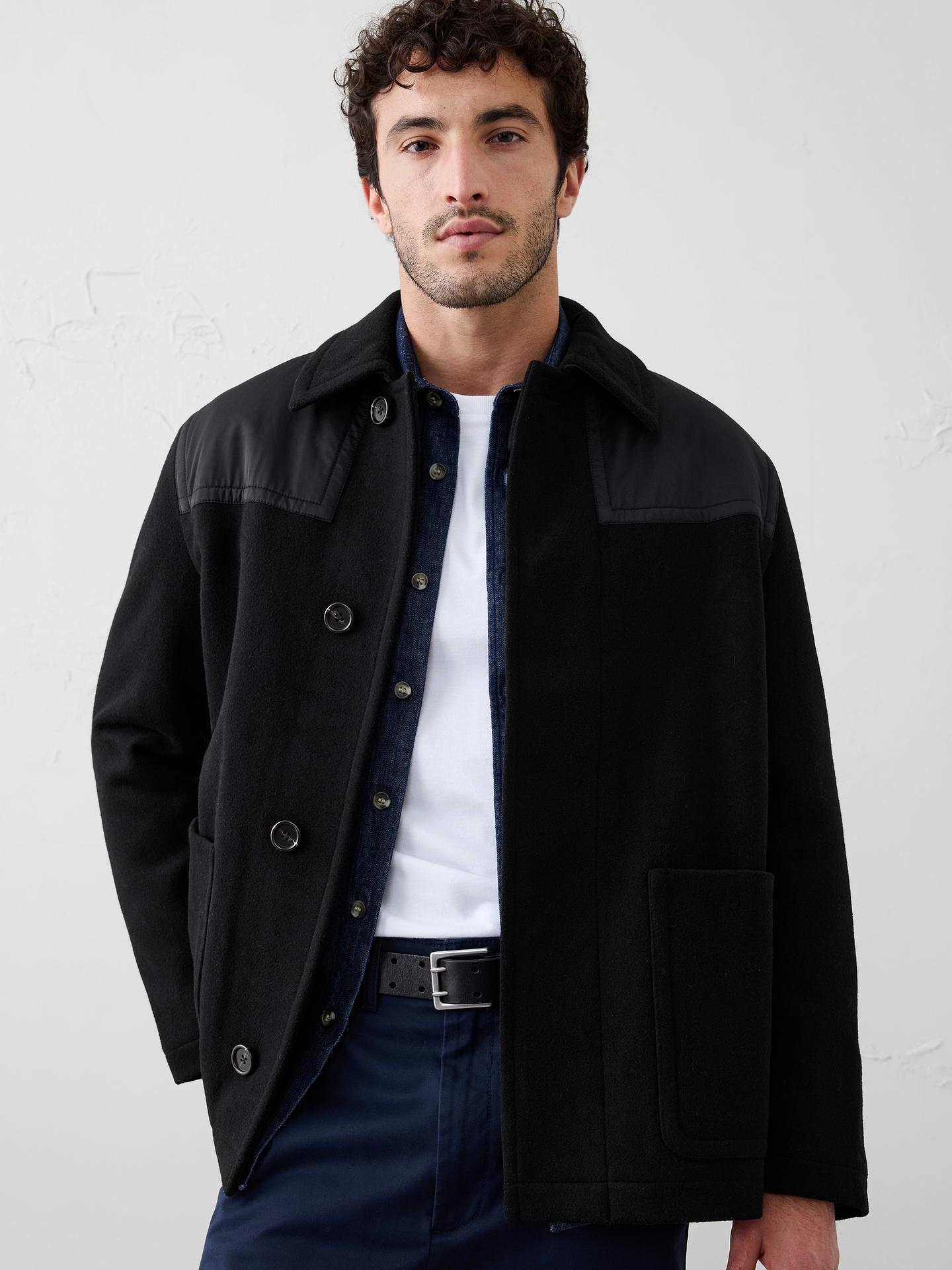 Image 1 of 4, Warmth meets structure in this wool-blend coat, designed with a clean covered placket and mixed media texture for modern edge., Point collar. Long sleeves., Hidden button front closure., Large patch pockets., Straight hem., Fully lined., Made exclusively for Banana Republic Factory., Product #785309