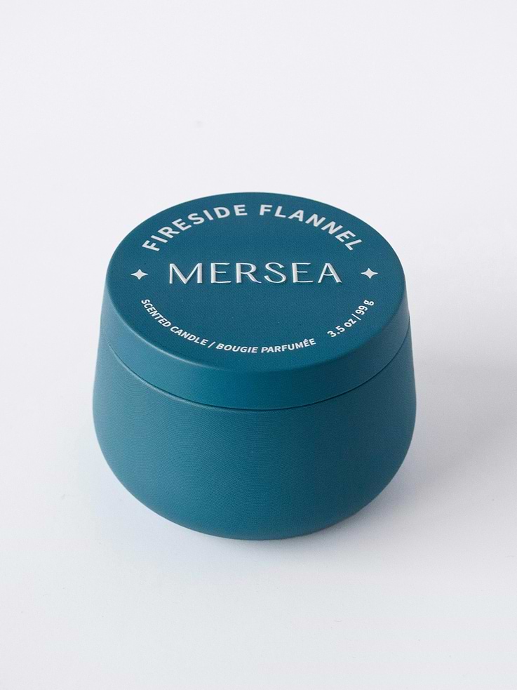 Image 1 of 2, Orange, Patchouli, Cedarwood., Zesty orange is grounded by earthy patchouli and freshly chopped cedarwood for a scent that is cozy and comforting, like a crackling fire and soft flannel on cool autumn nights., Celebrate the playtime of holidays with our Toy Shop Tin Candle., This collectible bunch offers a colorful pop with scents that will stop your friends and neighbors in their tracks., This simple and darling gift is easy to grab and go to your next holiday stop and they won’t stop talking about the scents—featuring our fan-favorite Sea Pines, Pumpkin Whimsea and our NEW SCENT Fireside Flannel.