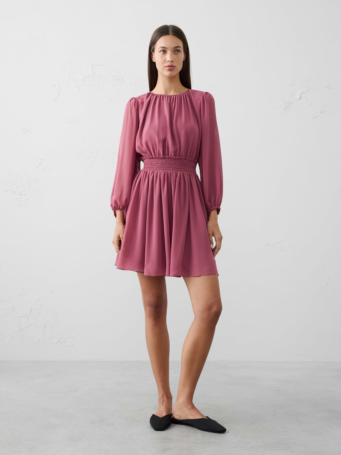Image 1 of 1, With a smocked waist and voluminous sleeves, this mini fit-and-flare dress is designed for movement, charm, and festive flair., Crew neck. Volume long sleeves with elasticated cuffs., Features smocked waist detailing., Fitted at the waist., Keyhole opening with button back closure., Flounce hem., Bodice and skirt lined., Made exclusively for Banana Republic Factory., Product #844316
