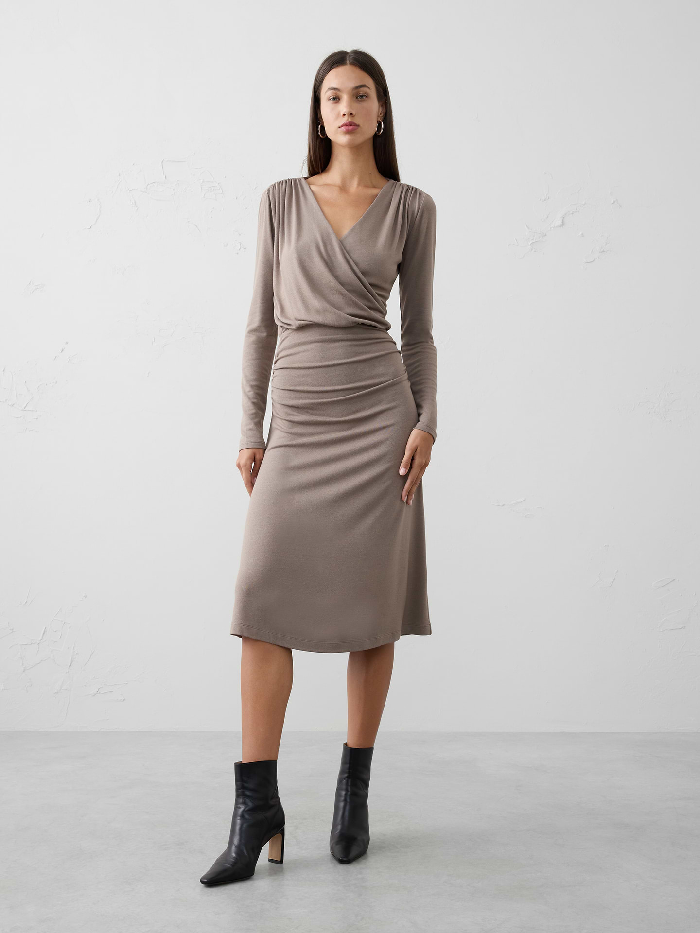 Image 1 of 1, Crafted in our best-selling Soft Luxe fabric, this wrap dress flatters with effortless drape and elevated comfort., V-neck. Long sleeves., Shirring at shoulder seam and placket., Lightweight elasticated waist with shirring detailing., Flare hem., Made exclusively for Banana Republic Factory., Product #844205