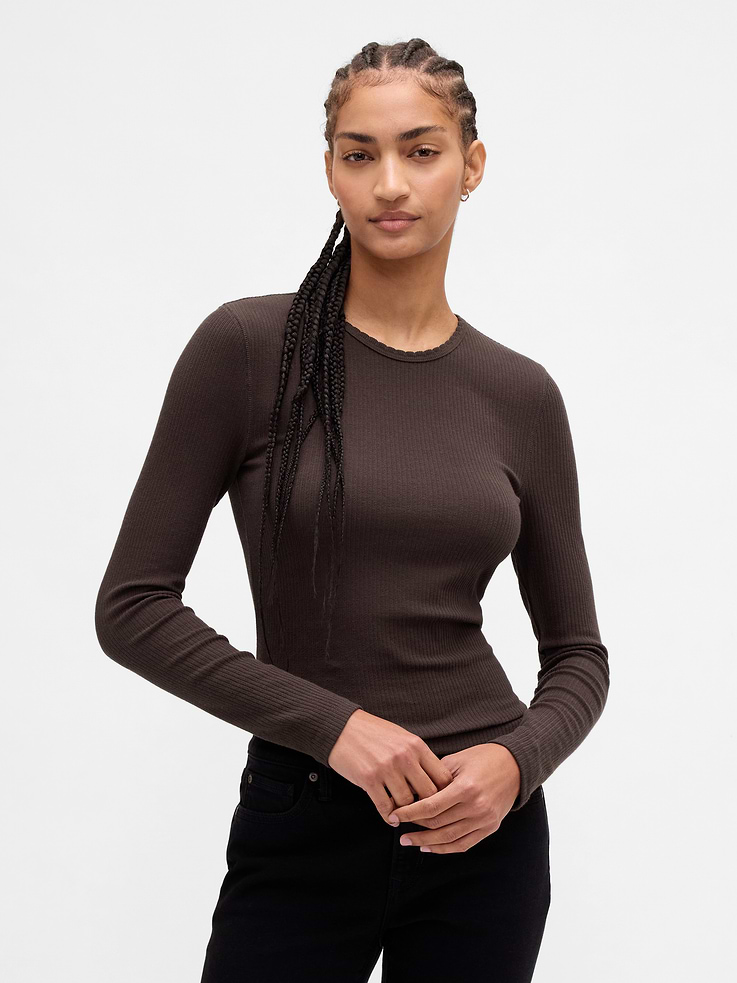 Image 1 of 4, Soft, stretch pointelle ribbed knit T-shirt. In a slightly cropped length., Crewneck., Long sleeves., Explore our GapTees Guide ., Product #843479