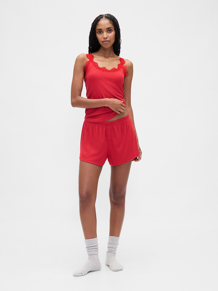 Image 1 of 6, Our slinky-soft, second-skin rib. Made with an ultra-fine texture that hangs just right., Supersoft, finely ribbed modal-blend pajama shorts., Elasticized waist with faux button fly., This product was made in a factory that invests in gender equity and women’s empowerment through RISE. Learn more at gapinc.com/equity ., Product #431286