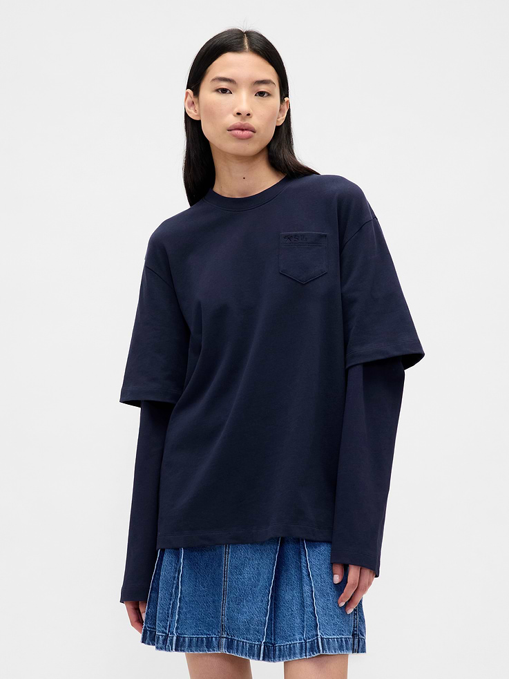 Image 1 of 2, Sandy Liang is designer born and raised in NYC. Inspired by nostalgia, she creates cult-favorite pieces influenced by childhood. Our collection draws from her memories of growing up with Gap. Archival hints. Playful details for adults. Elevated designs for kids. A celebration of modern girlhood only Gap × Sandy Liang could make., Soft, heavyweight cotton jersey layered T-shirt., Crewneck., Layered short and long sleeves., Embroidered patch pocket at chest., Made with 100% organically grown cotton which is grown without the use of synthetic pesticides and fertilizers., Product #860770