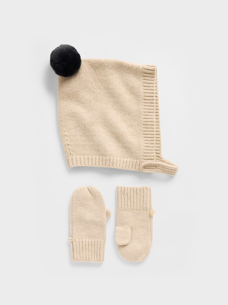 Image 1 of 1, Our bestselling fabric that feels cashmere-soft. Crafted in a midweight plush yarn. Refined with a special brushed technique. It's everyday luxury., Supersoft knit hat and mittens set., Pom applique at top., Chin strap with soft closure., Button & loop closure at mittens to hold pair together., Note: Sizes 0-6 months do not feature thumb holes., This product was made in a factory that invests in gender equity and women’s empowerment through RISE. Learn more at gapinc.com/equity., Product #821166