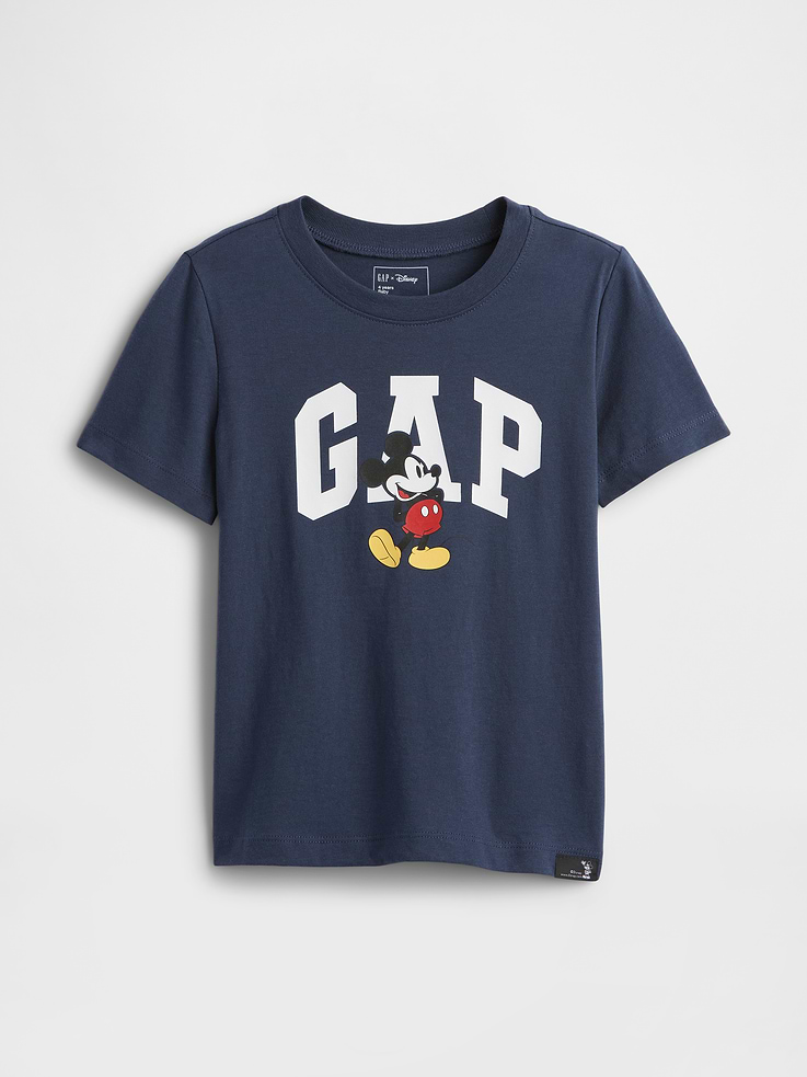Image 1 of 3, A very special collaboration between Gap and Disney— two timeless, iconic American brands— led us to create a collection that celebrates Mickey Mouse and Minnie Mouse., Soft jersey knit., Short sleeves., Crewneck., Gap logo with Mickey Mouse graphic at front., This product was made in a factory that invests in gender equity and women’s empowerment through RISE. Learn more at, Product #820848