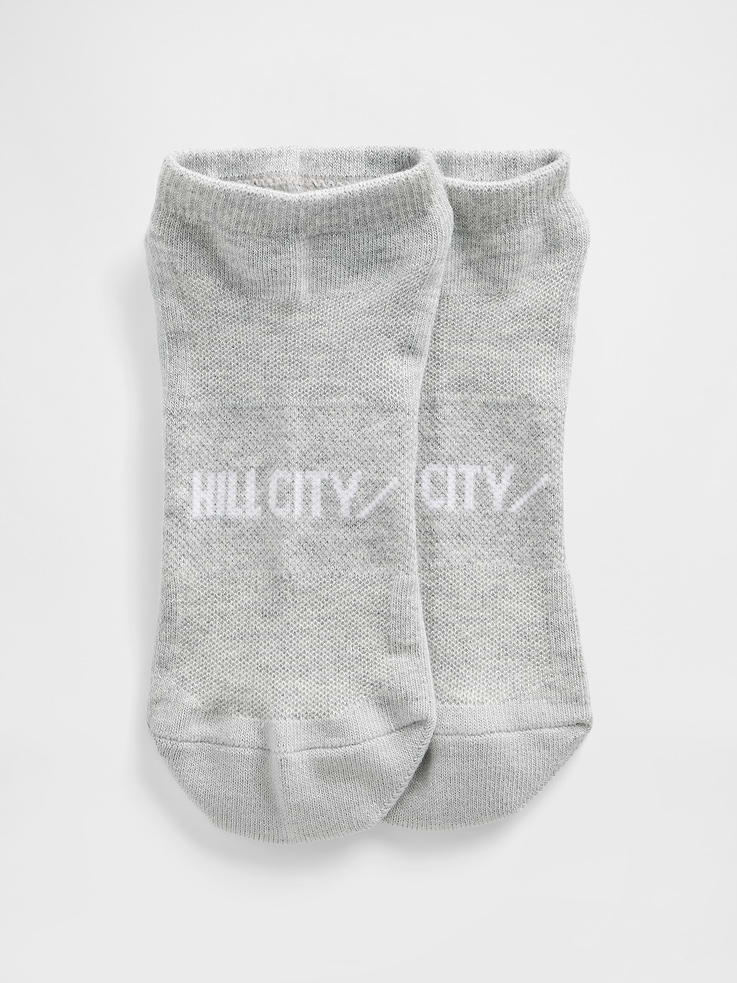 Image 1 of 1, A collection of our favorite accessories from Hill City, a performance brand known for technical fabrics and modern fits., Soft stretch knit ankle socks., Ribbed top., Reinforced toe and heel., Hill City logo at top., Product #850450