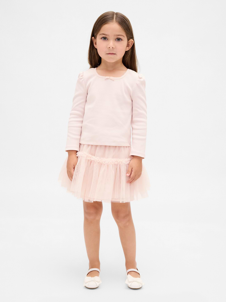 Image 1 of 3, Soft, ribbed stretch cotton top and mesh tulle skirt outfit set., Scoop neck with velvet bow at front., Long puff sleeves., Elasticized waist at skirt., Ruffled, tiered tulle outer., Cotton lining., This product was made in a factory that invests in gender equity and women’s empowerment through RISE. Learn more at gapinc.com/equity., Product #833190