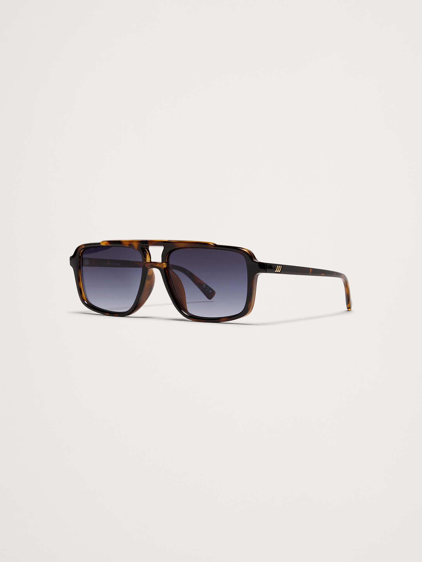 Image 1 of 3, Designed for impact and comfort, Le Gars redefines the aviator silhouette with a bold, structured shape tailored for broader face shapes., Le Specs: Since 1979, Le Specs has become renowned globally for its iconic and innovative sunglass collections, developing an international cult following., Made using lightweight, durable and impact resistant polycarbonate frame., Shatterproof and scratch resistant polycarbonate lenses.​, Includes protective pouch and microfiber cleaning cloth., Product #872262