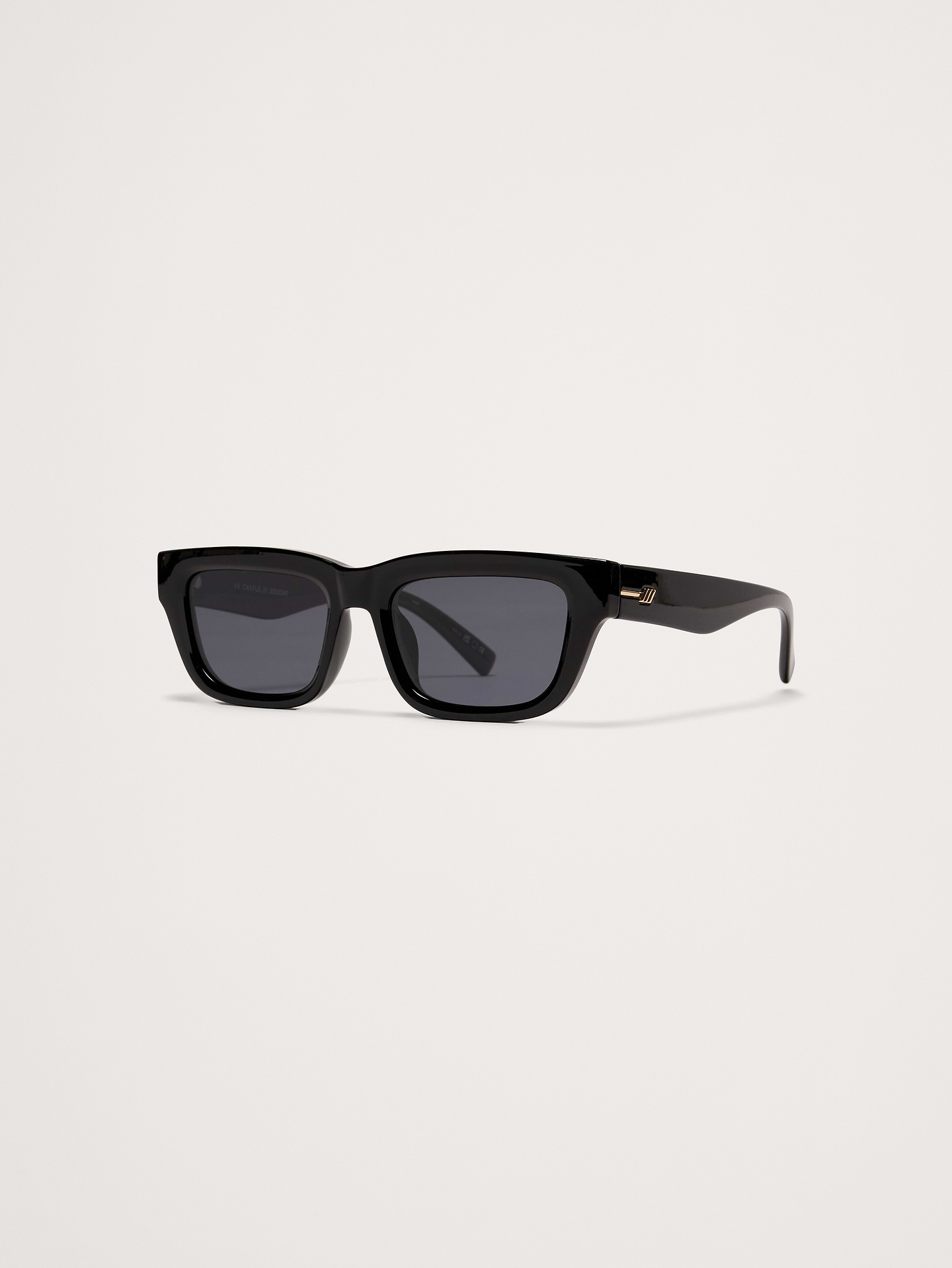 Image 1 of 5, Defined by its sharp angles and structured silhouette, Le Castle reimagines a classic rectangular frame with a bold, modern edge., Le Specs: Since 1979, Le Specs has become renowned globally for its iconic and innovative sunglass collections, developing an international cult following., Made using lightweight, durable and impact resistant polycarbonate frame., Shatterproof and scratch resistant polycarbonate lenses.​, Includes protective pouch and microfiber cleaning cloth., Product #872263