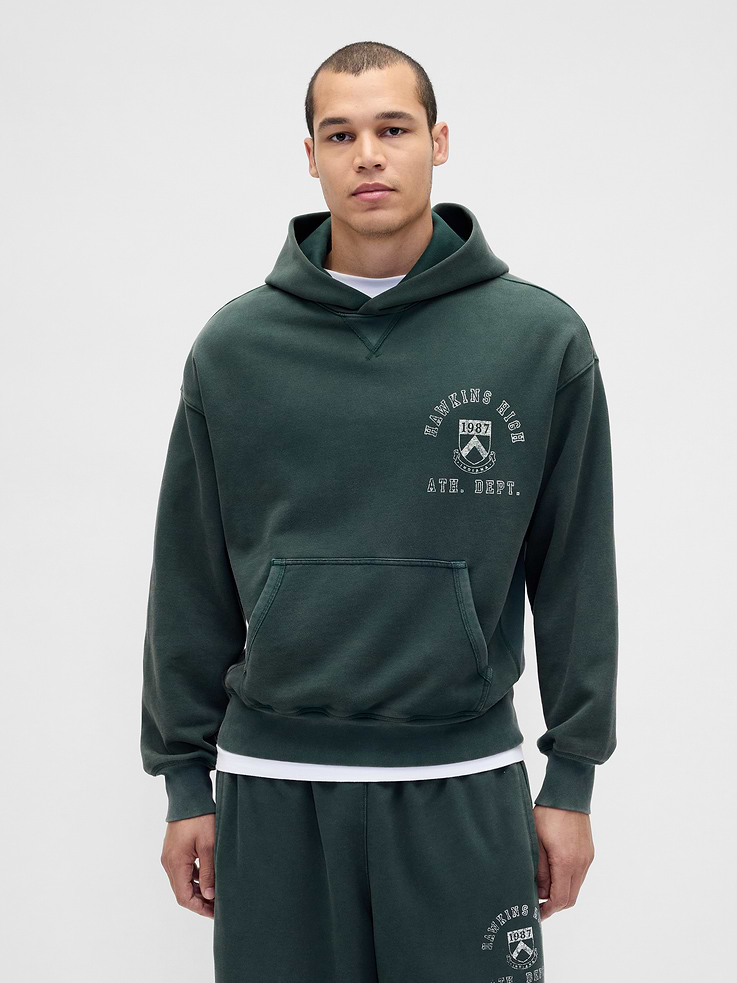 Image 1 of 2, A capsule created for one last adventure in the Upside Down. Where the weird and wild collide. And nostalgia becomes new again., Soft, 400-GSM heavyweight fleece hoodie., Hooded neckline., Long sleeves., Kanga pocket., Banded hem., Stranger Things graphics., Made with 14% recycled polyester. Compared to virgin materials, using recycled materials helps reduce resource use and waste., Explore our GapSweats Guide ., Product #865231