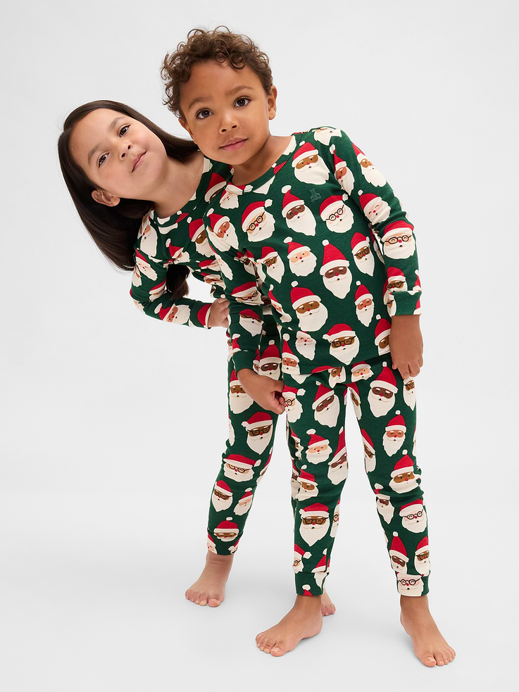 Image 1 of 5, Our comfiest PJs—now softer than ever. Cozy brushed cotton on the inside. All their favorite prints & colors on the outside., Soft cotton pajama top and pants set with a cozy brushed interior., Crewneck., Long sleeves., Embroidered Brannan Bear at chest., Elasticized waist at PJ pants., Banded cuffs., Assorted allover holiday prints., Made with 100% organically grown cotton, which is grown without the use of synthetic pesticides and fertilizers., Note: Sizing for select prints extends up to 12 YRS., Shop matching PJs for all., This product was made in a factory that invests in gender equity and women’s empowerment through RISE. Learn more at gapinc.com/equity., Product #844480