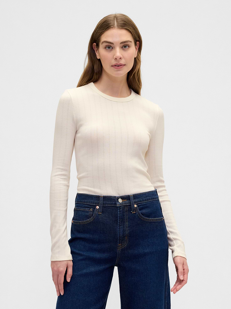 Image 1 of 5, Soft ribbed knit., Long sleeves., Crewneck., This product was made in a factory that invests in gender equity and women’s empowerment through RISE. Learn more at, Product #855107