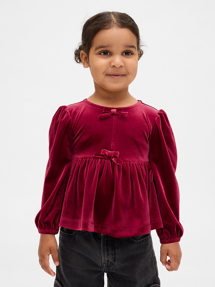 Image 1 of 4, Soft stretch velour top., Round neck with keyhole button closure at back., Long puff sleeves with elasticized cuffs., Bow details at front., Shirring at peplum hem., Product #845093