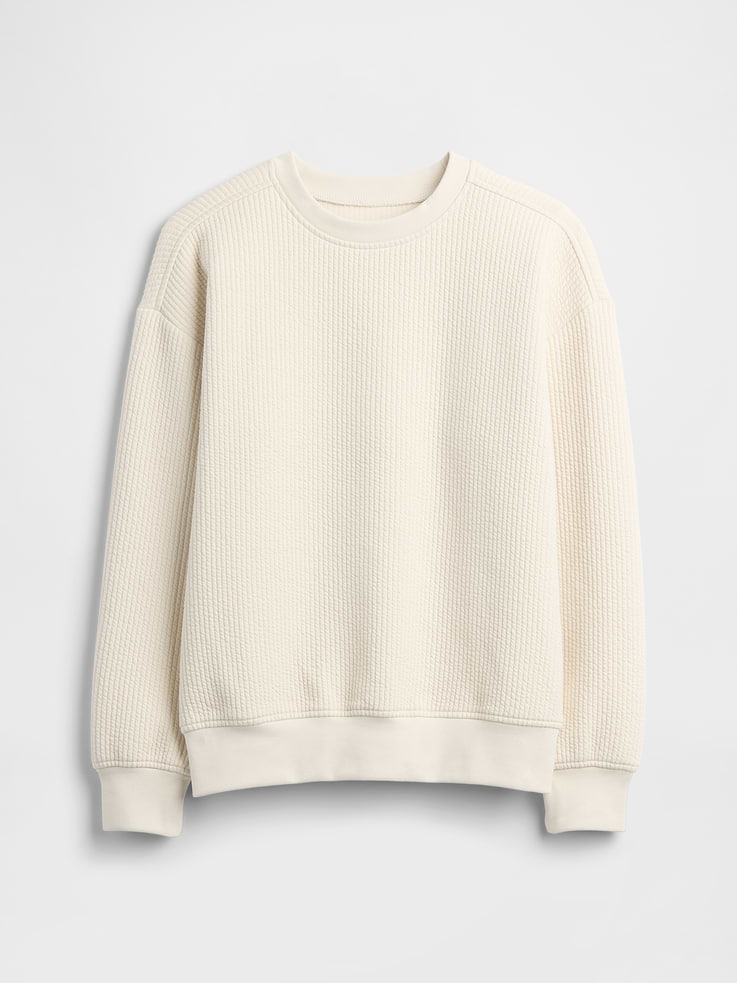 Image 1 of 3, This product is made with/contains 43% recycled polyester. Compared to virgin materials, using recycled materials helps reduce resource use and waste., Textured jacquard knit., Dropped shoulder, long sleeves with banded cuffs., Crewneck., Banded hem., This product was made in a factory that invests in gender equity and women’s empowerment through RISE. Learn more at, Product #847478