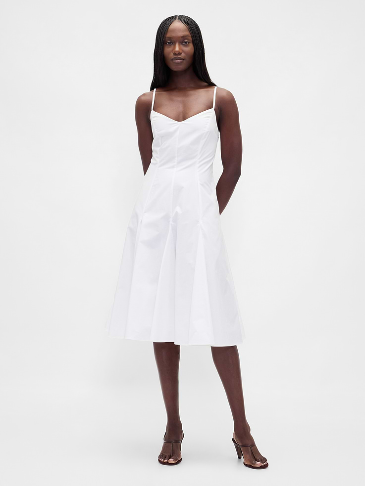 Image 1 of 5, Soft, crisp poplin cotton midi dress., V-neck., Adjustable spaghetti straps., Concealed zipper with hook-and-eye closure at back., Seaming at waist., Smocking at back., Princess seams, godets at skirt., Certain styles are fully lined., Product #877571