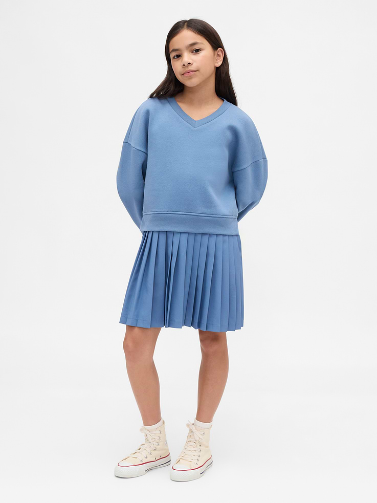 Image 1 of 4, Our softer than soft sweats. Brushed on the inside. Smooth on the outside. Made so that no two are alike., Soft cotton-blend fleece sweatshirt with attached breathable, quick-dry, stretch active knit skirt., V-neck., Long sleeves with drop shoulders., Banded cuffs & hem at top., Attached pleated skirt., Sweatshirt top made with 23% recycled polyester. Compared to virgin materials, using recycled materials helps reduce resource use and waste., Product #869860