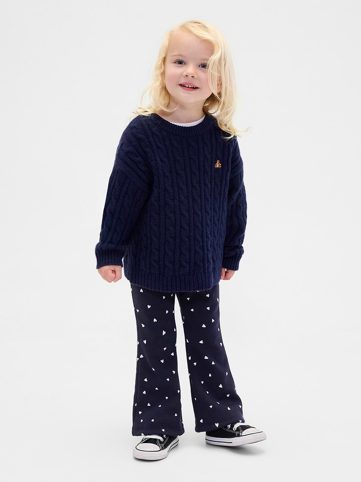 Image 1 of 4, Soft stretch knit cozy-lined flare leggings., Elasticized waist., Certain styles have an allover heart print., Made with 37% recycled polyester. Compared to virgin materials, using recycled materials helps reduce resource use and waste., Product #842889