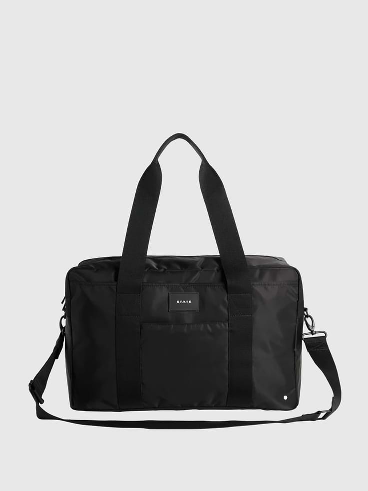 Image 1 of 7, Perfect for overnight stays, long weekends, and everything in between, we've thought of everything with this duffle style weekender including a padded laptop pocket, interior organization, detachable pouches, and a hidden travel sleeve—it holds everything you need and keeps you feeling and looking put together wherever you go., 45% of this bag is made from recycled materials., For every bag sold, STATE donates a percentage of the proceeds to American families in need., STATE is the family bag company that’s carrying everyone, everywhere, through the journey of life with open hands.