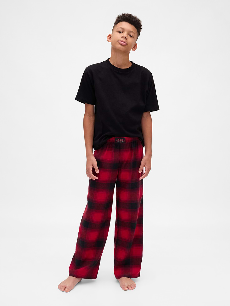 Image 1 of 2, A capsule created for one last adventure in the Upside Down. Where the weird and wild collide. And nostalgia becomes new again., Soft flannel pajama pants., Elasticized waist with logo detail., Embroidered Demogorgon at thigh., Allover plaid print., Made with 100% recycled polyester. Compared to virgin materials, using recycled materials helps reduce resource use and waste., Product #866235