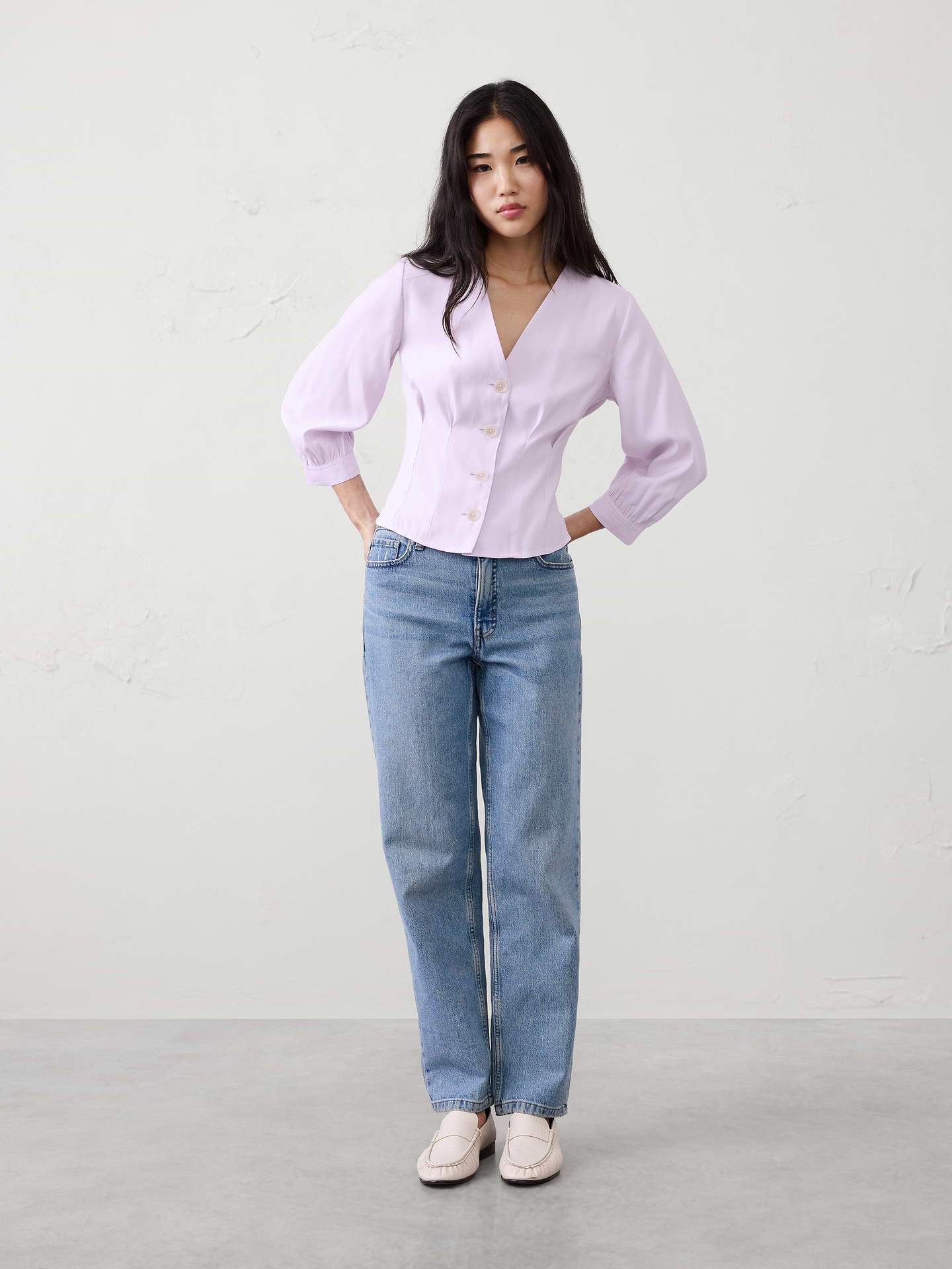 Image 1 of 1, Soft, drapey twill meets a tailored fit., V-neck. Three-quarter length sleeves with buttoned cuffs., Button front closure., Features pleated front detailing., Center back seam., Two back waist darts., Straight hem., Made exclusively for Banana Republic Factory., Product #844164