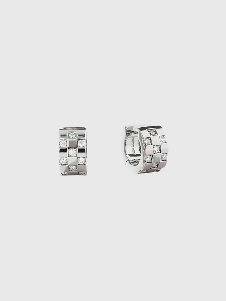 Image 1 of 3, These silver hoop earrings are plated in rhodium and feature a unique squared-off inlay with sparkly cubic zirconia embellishments for an eye-catching finishing touch., This shiny pair can be styled on its own but we’d recommend adding another huggie set for an even sparklier stack., Cubic zirconia embellishments., Rhodium-plated hoop earrings., Tarnish-Free., Water-Resistant., Hypoallergenic., Ana Luisa is a jewelry brand founded in 2018 to elevate everyday, with Earth-friendly jewelry that lasts.