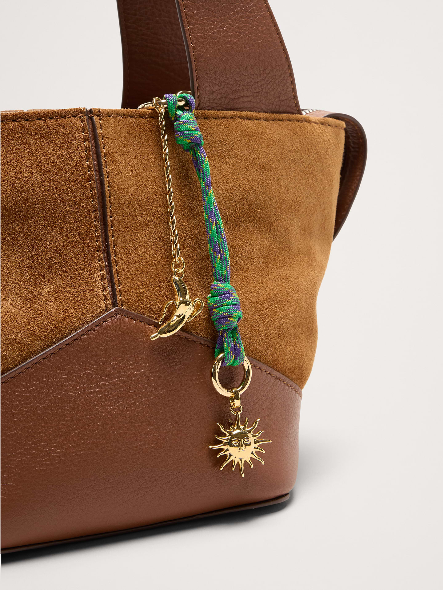 Image 1 of 1, A mix of nylon and 14k-gold plated metal, this optimistic bag charm is the perfect, playful mix of high and low., Martha Calvo: Miami-based jewelry brand known for bold chains, freshwater pearls, and playful, high-impact pieces made by hand. Designed to be mixed, matched, and enjoyed., 14k-gold plated brass., Removable charms for more ways to wear., Product #893309