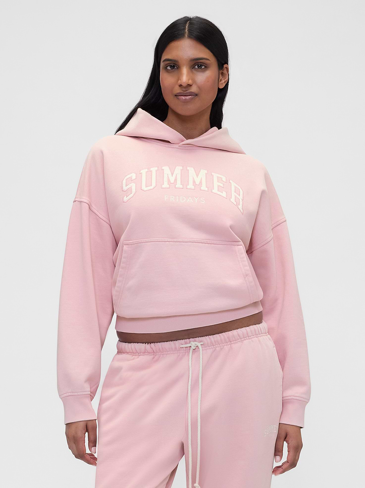 Image 1 of 7, Summer Fridays is a California beauty brand, known for its simplicity and ease. Made for the skin and the senses. We’ve partnered on this collection, bringing Summer Fridays together with Gap’s lounge essentials. Designed to unwind in., Soft, heavyweight fleece hoodie. In an oversized fit., Hooded neckline., Long sleeves with dropped shoulders and embroidered Gap logo at cuff., Summer Fridays arch logo at front., Kanga pocket., Made with 14% recycled polyester. Compared to virgin materials, using recycled materials helps reduce resource use and waste., Product #856415