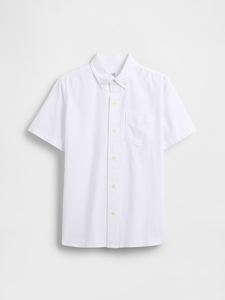 Image 1 of 3, Smooth oxford weave., Short sleeves., Button down collar, button front., Patch pocket at chest., Curved shirttail hem is slightly longer at back., Select styles have allover print or stripes., Note: The dye used in the crafting of this product is prone to crocking, or color transfer. Please avoid contact with light-colored fabric or upholstery., This product was made in a factory that invests in gender equity and women’s empowerment through RISE. Learn more at, Product #1172806