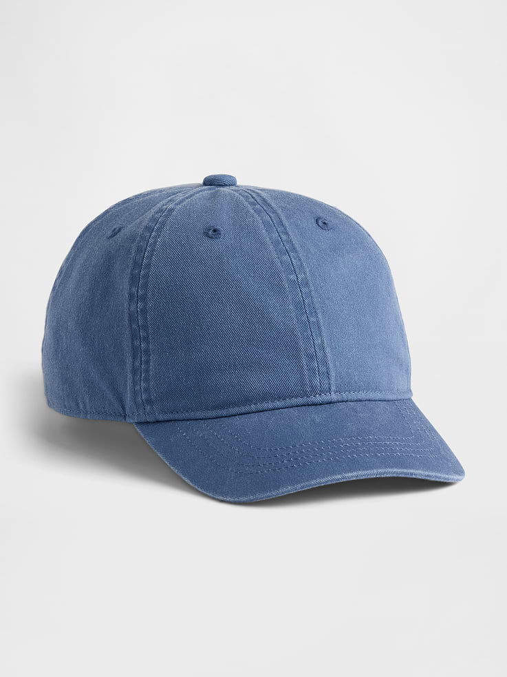 Image 1 of 2, Soft overdye cotton twill 6-panel baseball hat., Stitching at curved brim., Adjustable closure at back., Assorted colors., Note: Standout pink styles require separate care instructions. The dye used in the crafting of this product is prone to crocking, or color transfer. Please avoid contact with light-colored fabric or upholstery., This product was made in a factory that invests in gender equity and women’s empowerment through RISE. Learn more at gapinc.com/equity ., Product #883748