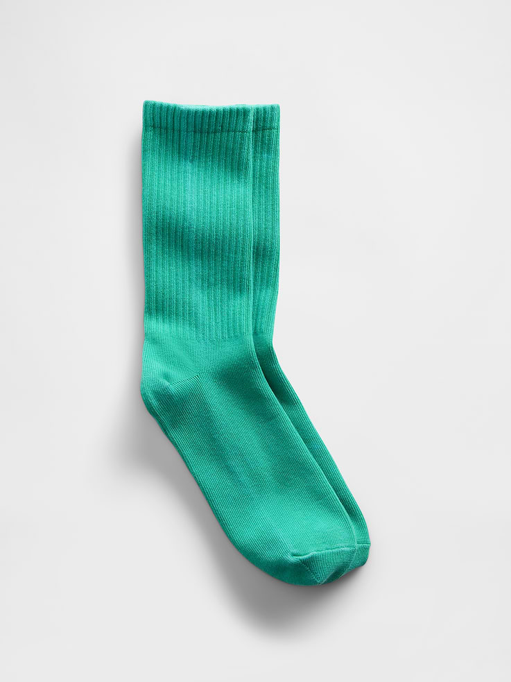 Image 1 of 2, Soft stretch knit crew socks., Ribbed top., Reinforced toe and heel., Made with 11% recycled polyester. Compared to virgin materials, using recycled materials helps reduce resource use and waste., This product was made in a factory that invests in gender equity and women’s empowerment through RISE. Learn more at gapinc.com/equity ., Product #874975