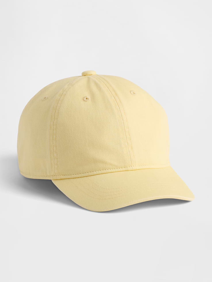 Image 1 of 2, Soft overdye cotton twill 6-panel baseball hat., Stitching at curved brim., Adjustable closure at back., Assorted colors., Note: Standout pink styles require separate care instructions. The dye used in the crafting of this product is prone to crocking, or color transfer. Please avoid contact with light-colored fabric or upholstery., This product was made in a factory that invests in gender equity and women’s empowerment through RISE. Learn more at gapinc.com/equity ., Product #883748
