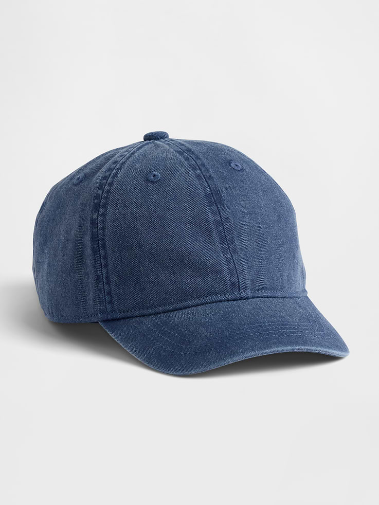 Image 1 of 2, Soft overdye cotton twill 6-panel baseball hat., Stitching at curved brim., Adjustable closure at back., Assorted colors., Note: Standout pink styles require separate care instructions. The dye used in the crafting of this product is prone to crocking, or color transfer. Please avoid contact with light-colored fabric or upholstery., This product was made in a factory that invests in gender equity and women’s empowerment through RISE. Learn more at gapinc.com/equity ., Product #883748