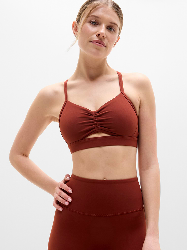 Image 1 of 5, BEST FOR STUDIO: yoga + barre + pilates, IMPACT: Light-impact workouts, best for A-C cups, FEEL: Powervita fabric is buttery soft with support that feels like a gentle hug, FAVE: Sleek racerback design provides distraction-free mobility and airflow, Built-in pockets with removable pads for optional coverage, Removable pads hold their shape from wash to wear, Lined with PowerMesh for breathable, sheer-proof coverage, Product #844714
