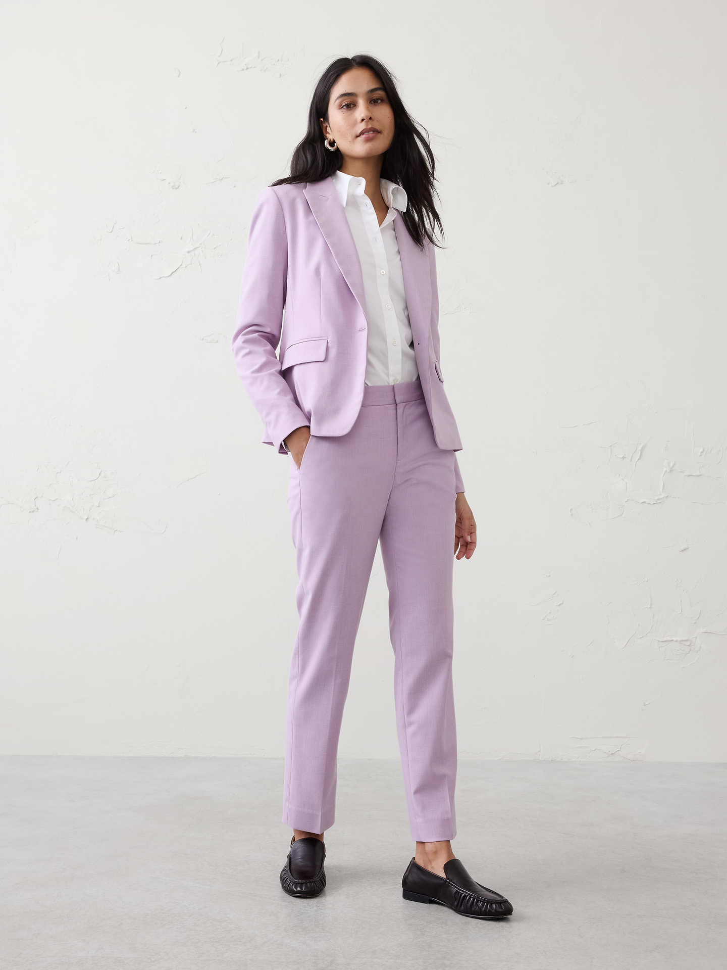 Image 1 of 7, CLASSIC COLLECTION: We've refined our most classic suiting styles in a stretch twill fabric for all-day comfort, adding a new level of polish to elevate any look., STRETCH TWILL FABRIC: Woven with viscose, which gives it a soft to-the-hand touch, has stretch and is sustainable., SUSTAINABILITY: Made with 50% recycled polyester., Full length., Hook-and-bar closure with zip fly. Belt loops., Front off-seam pockets. Rear welt pockets., Trouser crease., Straight leg. Slim fit., Made exclusively for Banana Republic Factory., Product #515549