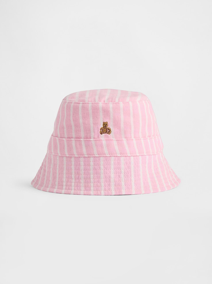 Image 1 of 1, A new summer essential, crafted in double-knit 100% cotton gauze. Soft and breathable. Light and airy. A signature — all season long., Soft cotton gauze baby bucket hat., Stitching at flutter brim., Embroidered Brannan Bear at front., Allover stripes., This product was made in a factory that invests in gender equity and women’s empowerment through RISE. Learn more at gapinc.com/equity ., Product #880473