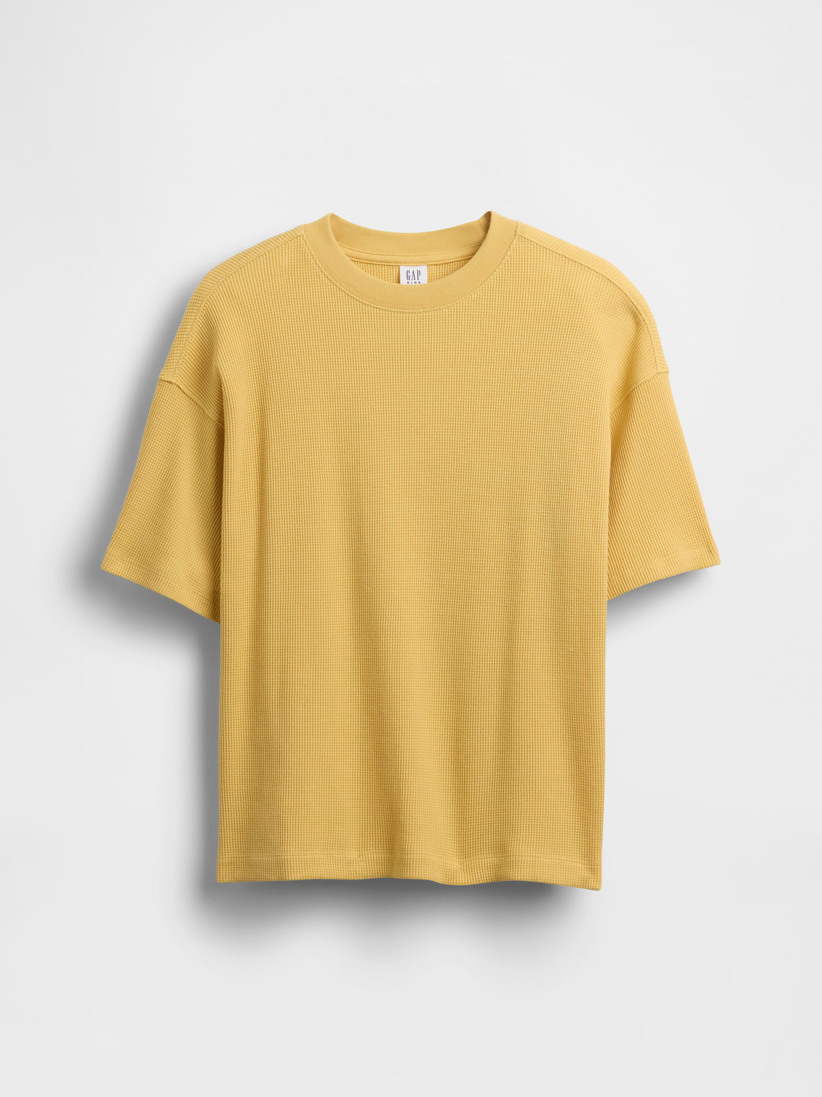 Image 1 of 3, Soft waffle-knit T-shirt in an oversized fit., Crewneck., Short sleeves with drop shoulders., This product was made in a factory that invests in gender equity and women’s empowerment through RISE. Learn more at gapinc.com/equity ., Product #887262