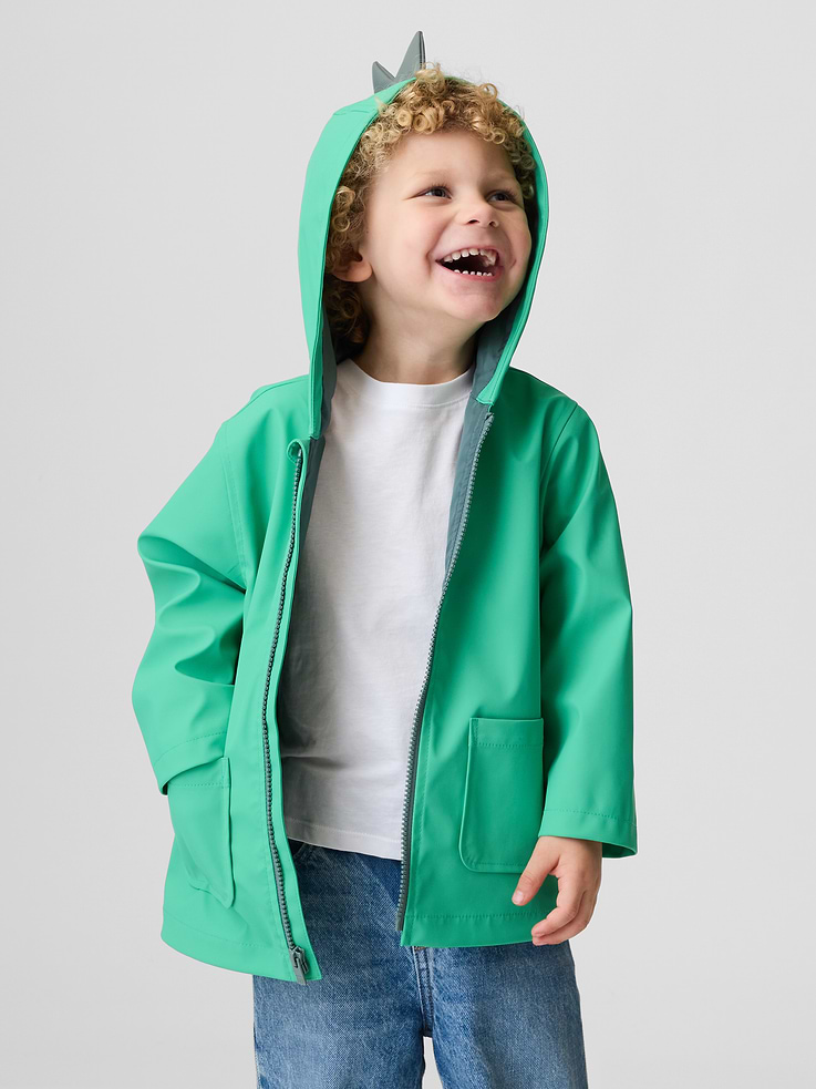 Image 1 of 3, Water-resistant rain jacket., Hooded neckline with 3D dinosaur detail at top., Long sleeves., Zipper front., Front patch pockets., Fully lined., Outer shell made with X% recycled polyester. Compared to virgin materials, using recycled materials helps reduce resource use and waste., Product #887561