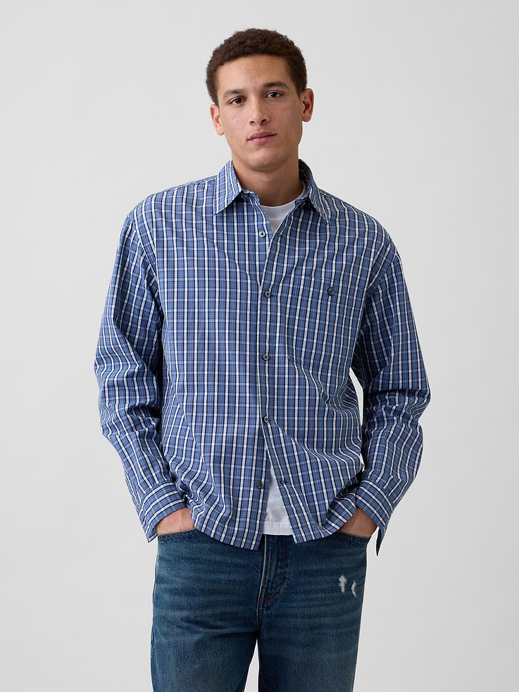Image 1 of 5, Smooth poplin weave., Dropped shoulder, long sleeves with button cuffs., Spread collar, button front., Patch pocket with button closure at chest., Select styles have allover print, stripes, or plaid., This product was made in a factory that invests in gender equity and women’s empowerment through RISE. Learn more at gapinc.com/equity., Product #1174173