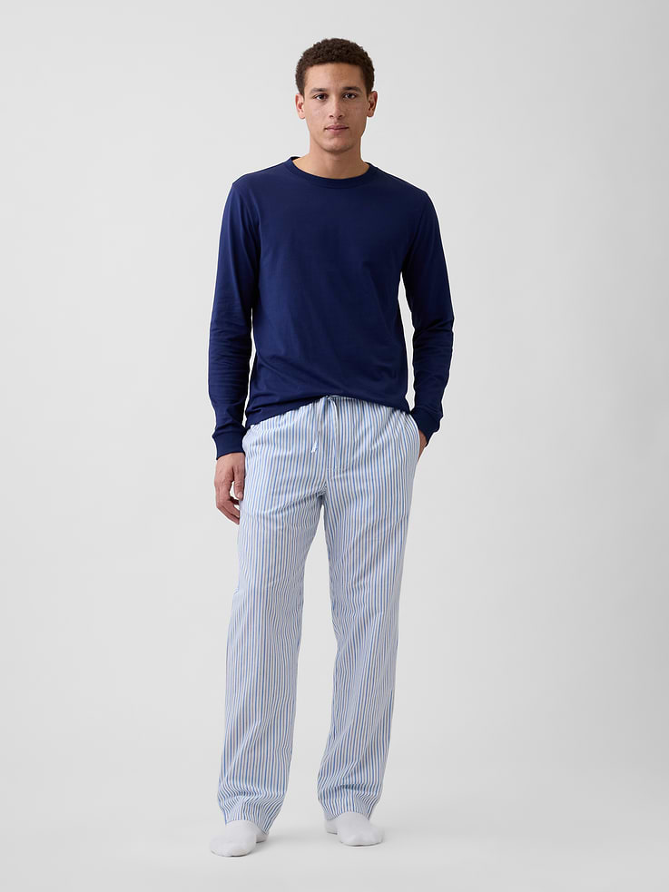 Image 1 of 4, Smooth poplin sleep pants., Drawcord ties at elasticized waist, faux fly., On-seam pockets., Select styles have allover print or stripes., This product was made in a factory that invests in gender equity and women’s empowerment through RISE. Learn more at, Product #1172630