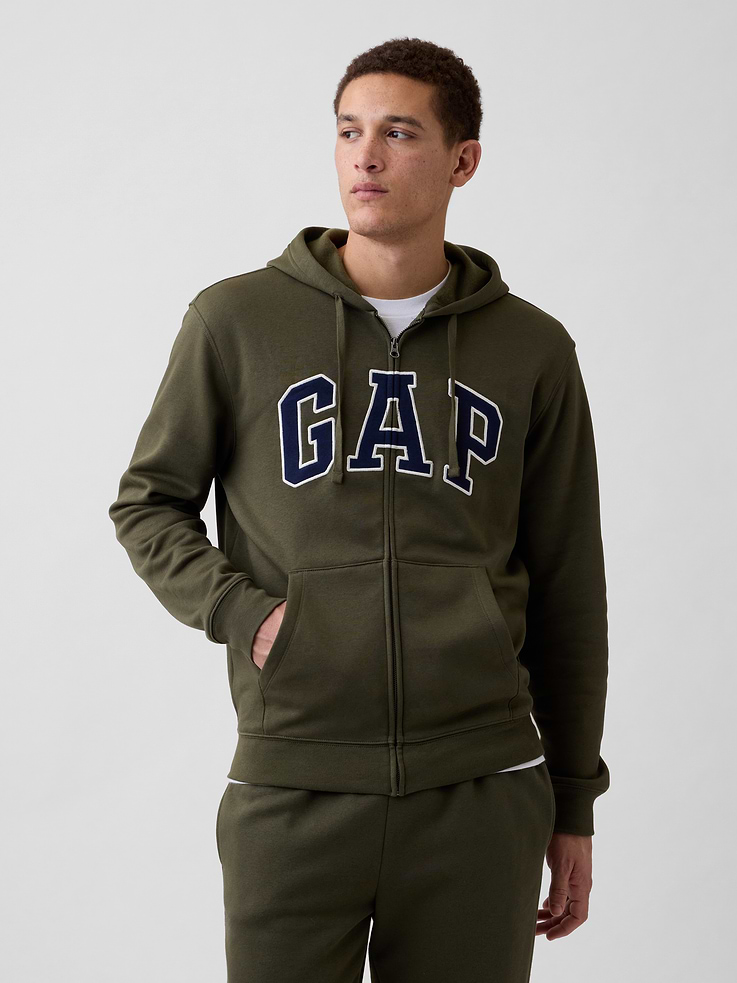 Image 1 of 7, Soft, comfy fleece., Dropped shoulder, long sleeves with banded cuffs., Drawcord ties at hood, zip front., Gap logo at front., Kanga pockets., Banded hem., This product was made in a factory that invests in gender equity and women’s empowerment through RISE. Learn more at, Product #683050