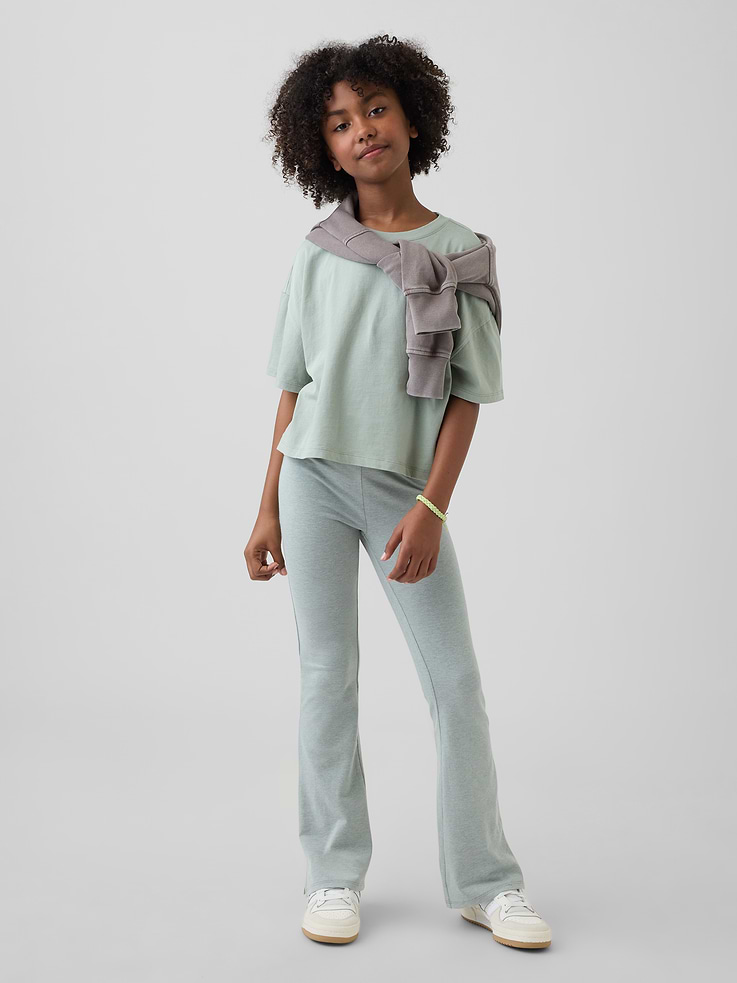 Image 1 of 5, Soft stretch knit flare leggings., Elasticized waist., Certain styles have allover prints., This product was made in a factory that invests in gender equity and women’s empowerment through RISE. Learn more at gapinc.com/equity ., Product #892523
