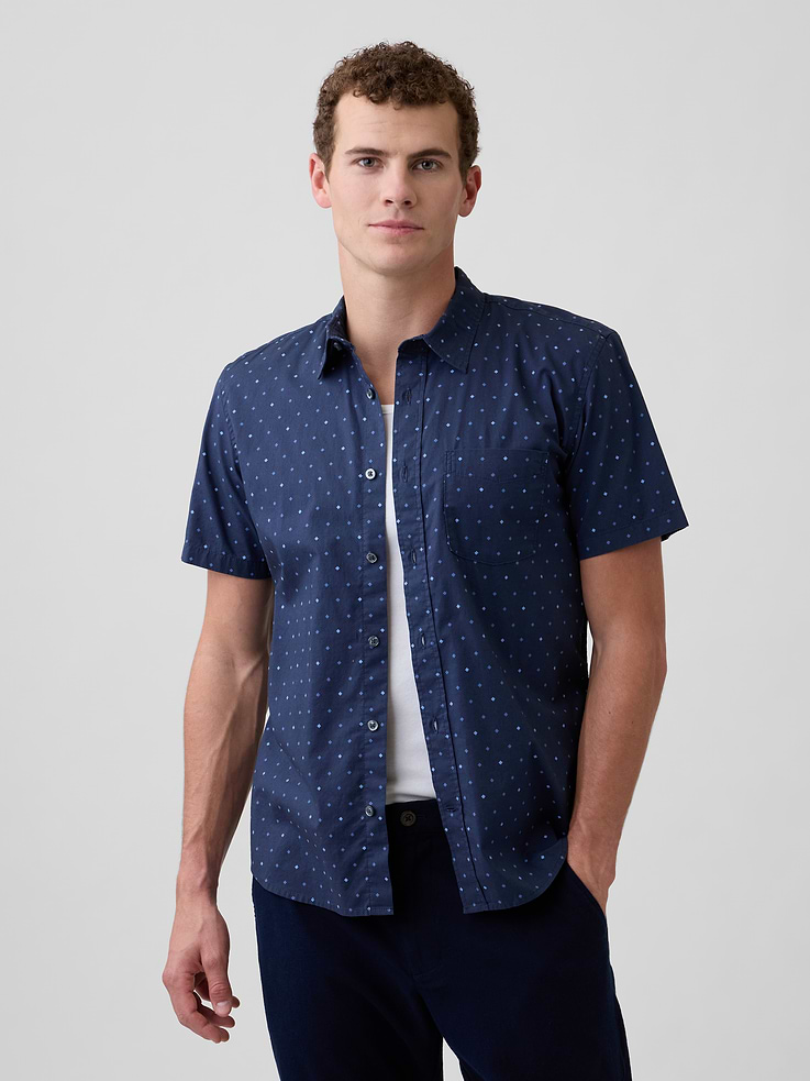 Image 1 of 5, Stretch poplin weave., Short sleeves., Spread collar, button front., Patch pocket at chest., Curved shirttail hem is slightly longer at back., Select styles have allover print, stripes, or plaid., This product was made in a factory that invests in gender equity and women’s empowerment through RISE. Learn more at, Product #716855