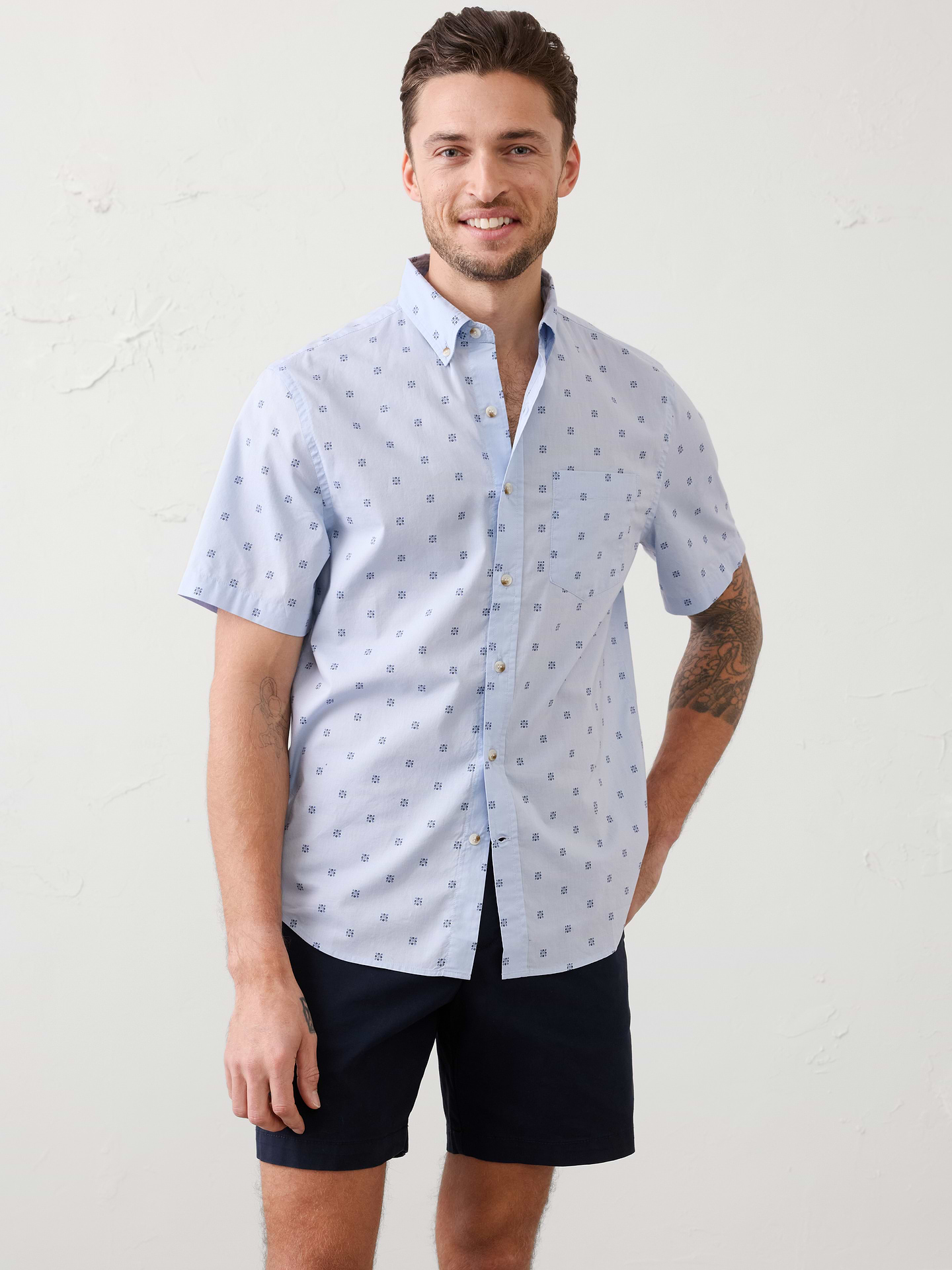Image 1 of 7, The iconic Softwash Cotton Shirt is crafted from 100% cotton for a soft hand feel and easy comfort from morning to night. Designed in our untucked fit with a clean shirttail hem, it's a wardrobe must have-in timeless patterns., UNTUCKED FIT: Designed with a shorter hemline to hit right at the hips., Button down collar. Short sleeves., Button front closure., Chest pocket., Back yoke., Shirttail hem., Available in long sleeve options., Made exclusively for Banana Republic Factory., Product #854597