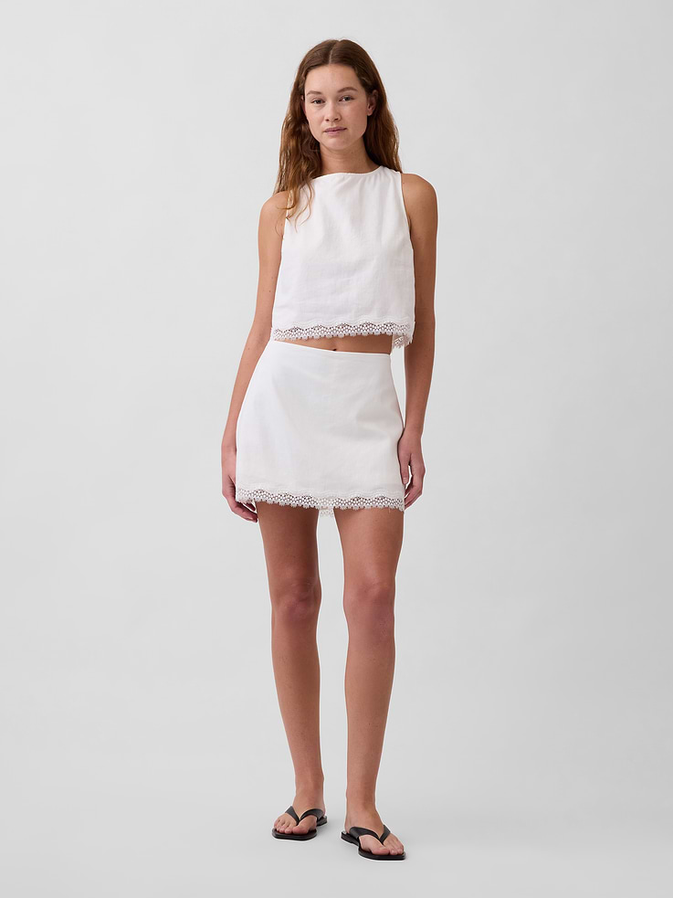 Image 1 of 6, Classic linen with the comfort turned up high. Expertly crafted for extra softness and breathability. Cut with the perfect drape., Soft, heavyweight linen-blend skort. In an ultra mini length., Concealed zipper with hook-and-eye closure at side seam., Lace trim at skirt hem., Inner shorts., This product was made in a factory that invests in gender equity and women’s empowerment through RISE. Learn more at gapinc.com/equity ., Product #877566